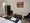 Ferienanlage Zum Knirk | Ferienwohnung 13 - Schlafzimmer - Doppelbett - Sitzbereich