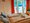 Ferienwohnungen Graap | Ferienzimmer Lachmöwe - Doppelbett - Sessel - Terrassentür
