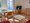 Pension Wiesenau | Bungalow - Wohnzimmer - Couch - Essbereich - TV
