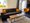 Van der Valk Resort Linstow | Ferienwohnung - Wohnzimmer - Couch - Lesesessel